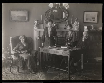 Portrait of the dentist Dr. Gibson and three women in his residence by Byron Company